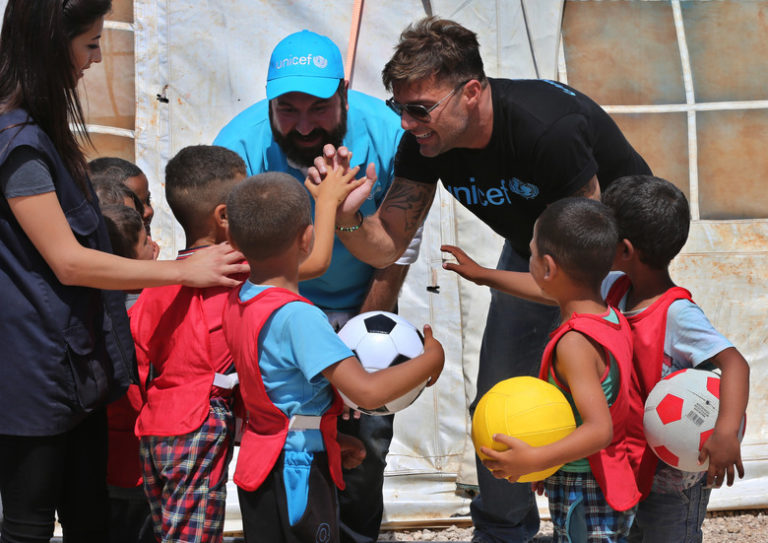 Ricky Martin greeting children on a UNICEF field visit