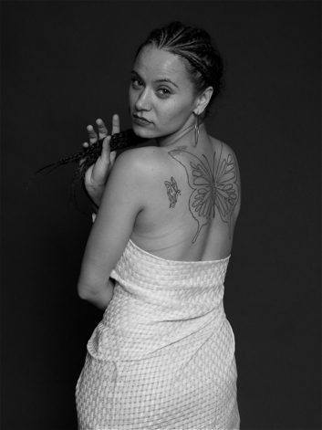 Black and white portrait of T Ortiz